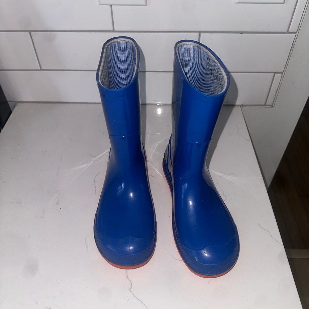 2 pairs of rain boots, blue and emoji boots